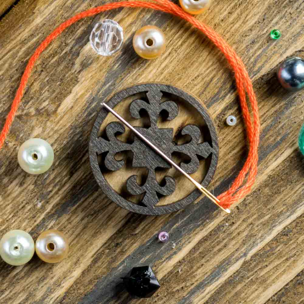 Round Ornate Wooden Needle Minder